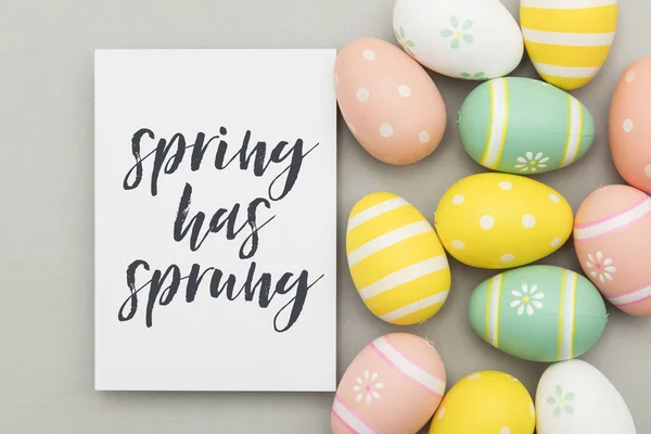 Colourful easter eggs with a handwritten easter message — Stock Photo, Image