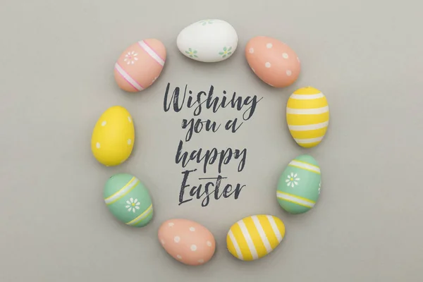 Colourful easter eggs with a handwritten easter message — Stock Photo, Image