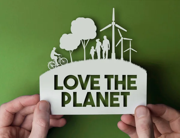 Love the planet - green environmental paper background with wind — Stock Photo, Image