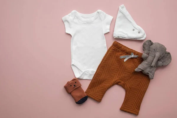 stock image Newborn child clothing layout on a pastel pink background