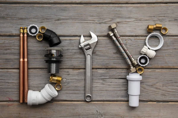 DIY, Do it yourself word made from plumbing equipment and tools — Stock Photo, Image