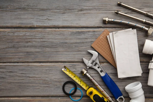 Plumbing tools and tiles. Home improvement background