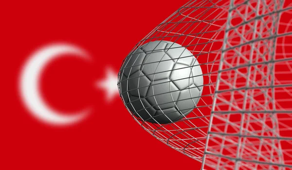 Balle de football marque un but dans un filet contre le drapeau de la Turquie. Rende 3D — Photo