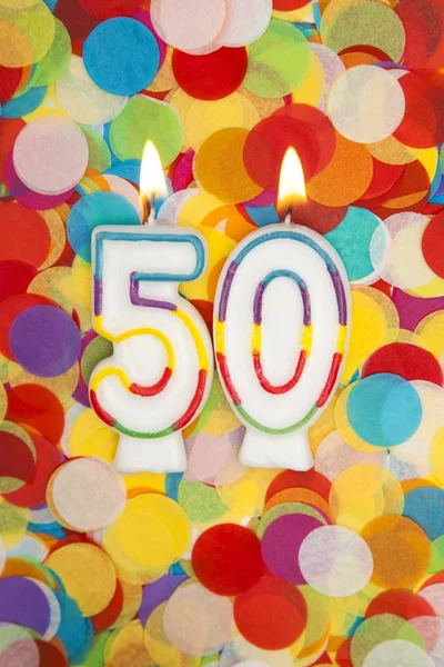 Celebracja świeca numer 50 na konfetti tle — Zdjęcie stockowe