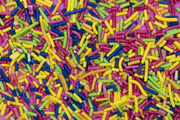 Colourful candy cake decorative sprinkles background — Stock Photo, Image