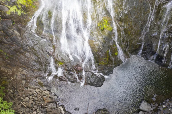 Aerial drone view of a beautiful waterfall and lake — Stock Photo, Image