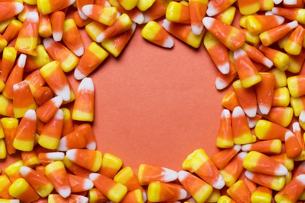 Halloween candy corn sweet background with copy space