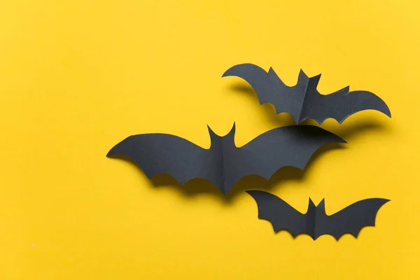 Halloween paper vampire bat decorations on an orange background. — Stock Photo, Image