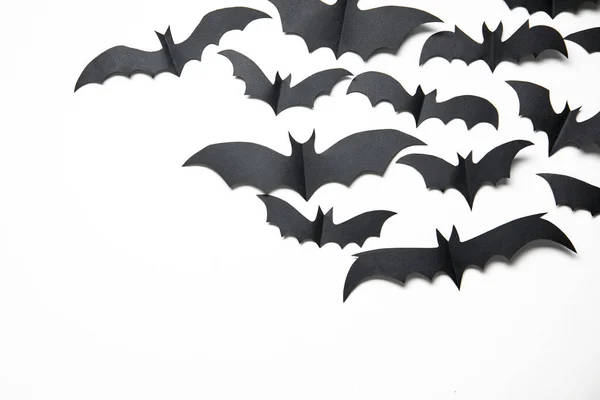 Halloween paper bat decorations on a white background.