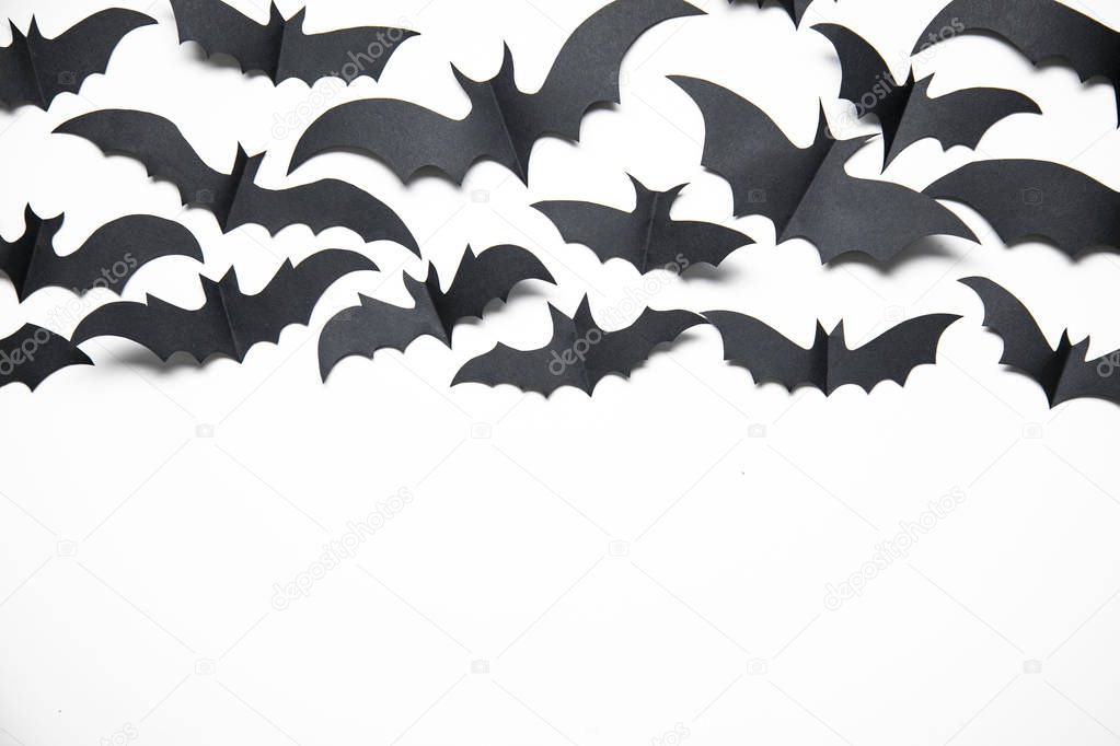 Halloween paper bat decorations on a white background.