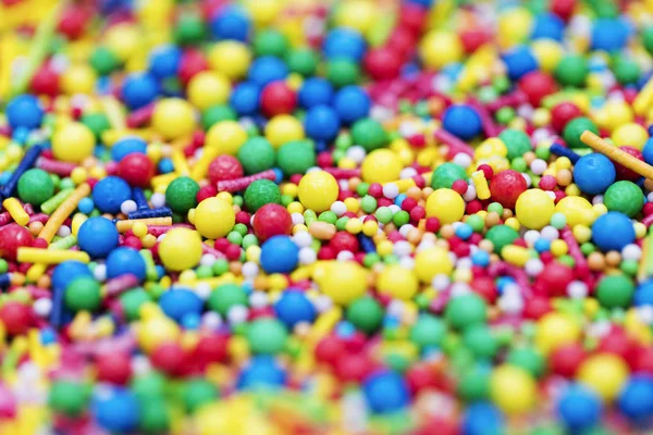 Colourful candy cake decorative sprinkles background — Stock Photo, Image