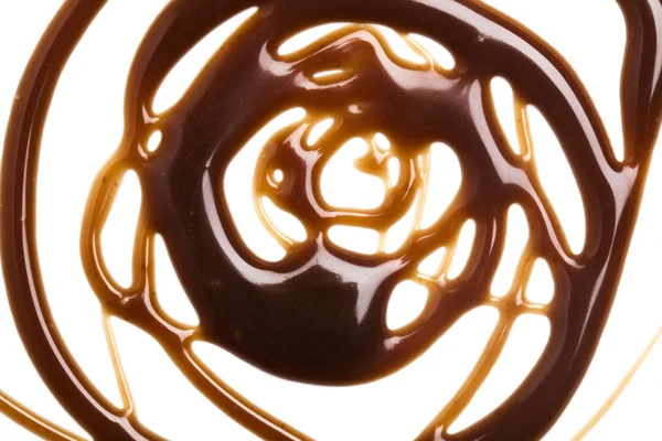 Шоколадний карамельний соус вихор на звичайному білому фоні — стокове фото