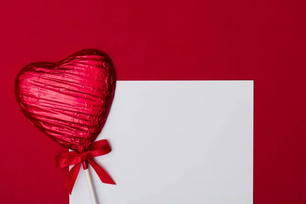 Heart shaped candy lolly valentine's day gift with a blank white — Stock Photo, Image