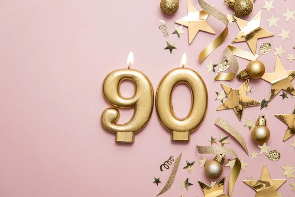 Numero 90 candela celebrazione d'oro su sfondo stella e glitter — Foto Stock