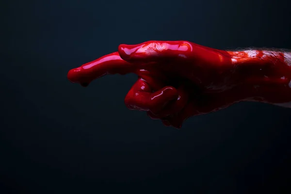 Bloody hand against a dark background. halloween horror concept — Stock Photo, Image