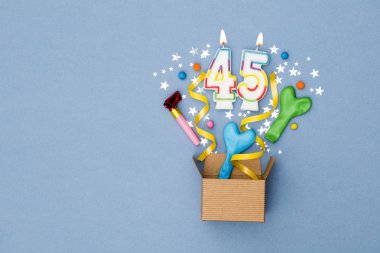Number 45 celebration present background. Gift box exploding wit clipart