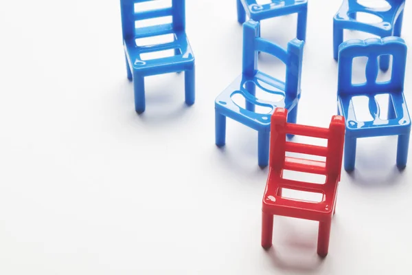 Collection of chairs with one odd one out. — Stock Photo, Image