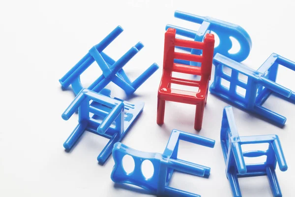 Collection of chairs with one odd one out. — Stock Photo, Image