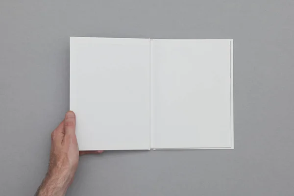 Book mockup. Male hand holding blank book. — Stock Photo, Image