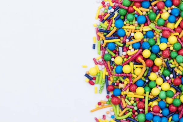 Colourful candy cake decorative sprinkles background — Stock Photo, Image