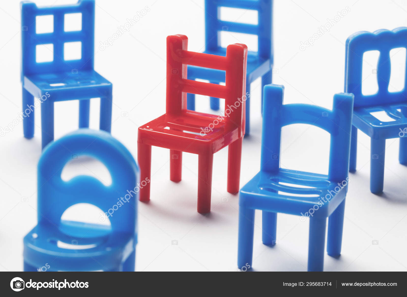 Collection of chairs with one odd one out. — Stock Photo