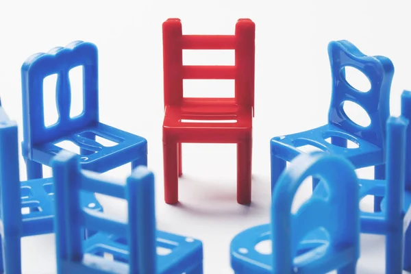 Circle of chairs with one odd one out. — Stock Photo, Image
