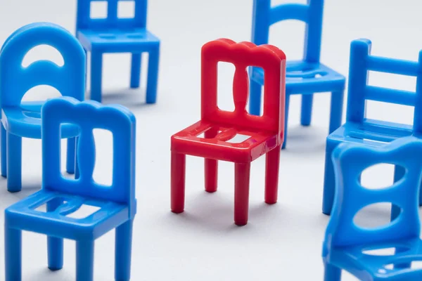 Collection of chairs with one odd one out. — Stock Photo, Image