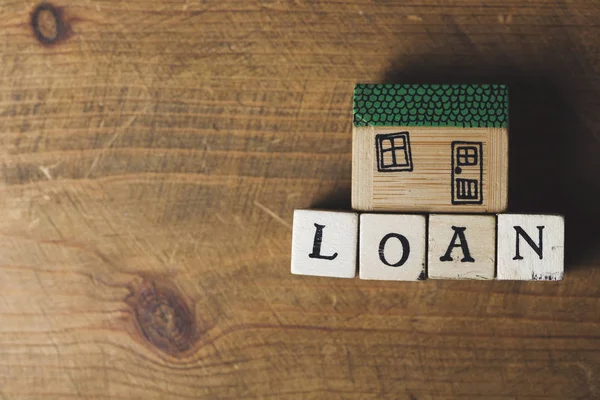 House model with loan word made from wooden blocks. Home finance — Stock Photo, Image