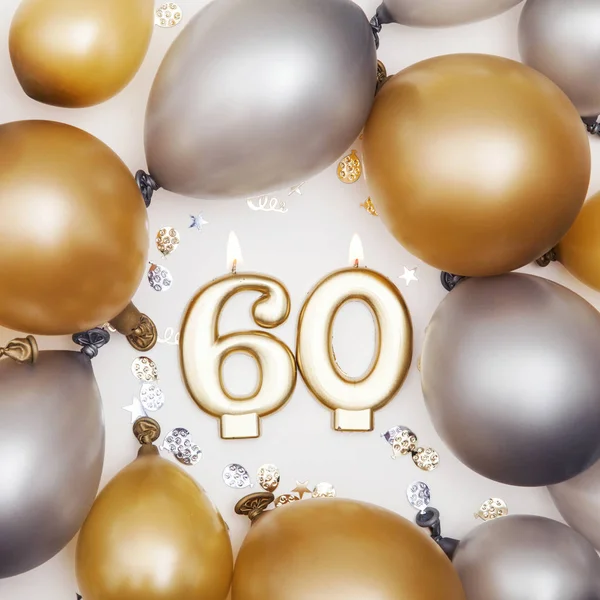 Uroczystość urodzinowa numer 60 świeca ze złotem i srebrnym ballo — Zdjęcie stockowe