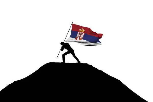 Bandera de Serbia empujada a la cima de la montaña por una silueta masculina . — Foto de Stock