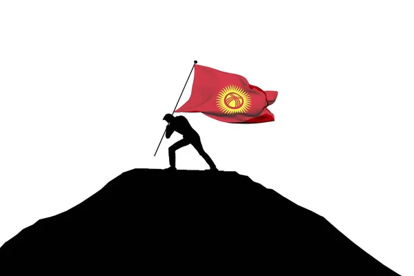 Bandeira do Quirguistão sendo empurrada para o topo da montanha por um silhueta macho — Fotografia de Stock