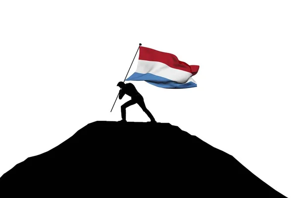 卢森堡国旗被一名男性西尔豪伊推入山顶 — 图库照片