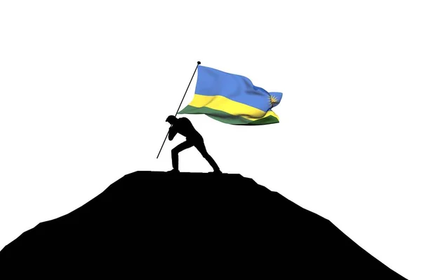 Руандійський прапор штовхнув у гірській вершині чоловічого силуету. — стокове фото