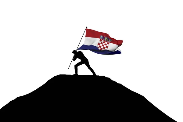 Bandera de Croacia siendo empujada a la cima de la montaña por una silueta masculina — Foto de Stock