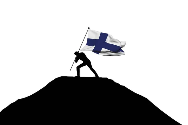 Drapeau de Finlande poussé au sommet d'une montagne par une silhouette masculine — Photo