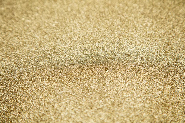 Gold star sparkle party confetti on a gold glitter background — Stock Photo, Image