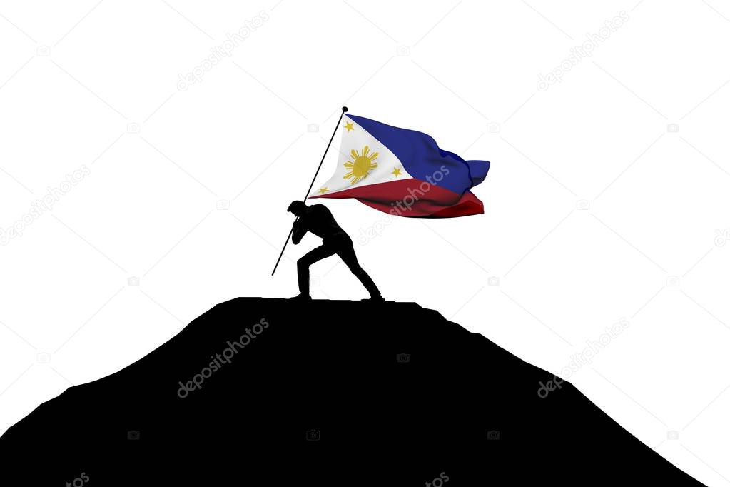 Philippines flag being pushed into mountain top by a male silhou