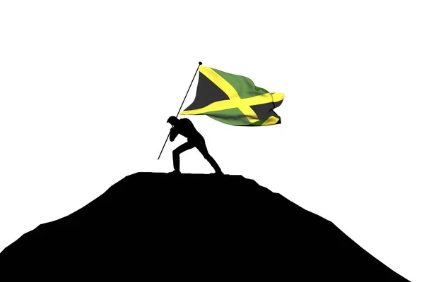 Jamaica zászló tolta a hegy tetejére egy férfi sziluett — Stock Fotó