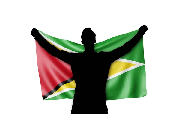 Mužská silueta držící státní vlajku Guyany. prostorové vykreslování — Stock fotografie