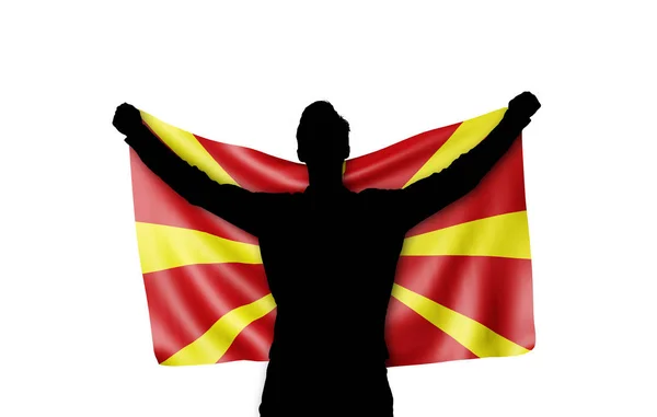 Male silhouette holding Macedonia national flag. 3D Rendering — Stock Photo, Image