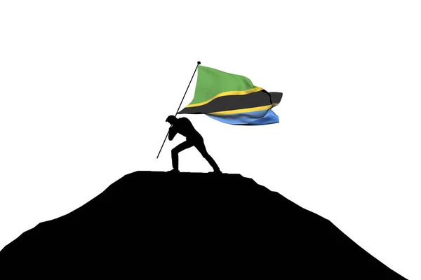 Bandiera della Tanzania spinta in cima ad una montagna da un silhouett maschio — Foto Stock
