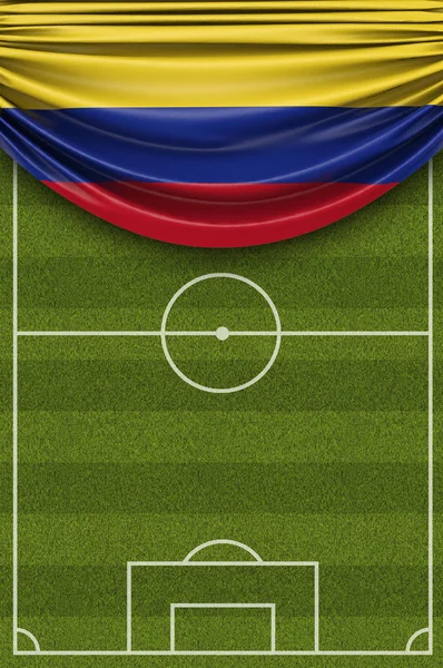 Colombia bandiera di paese drappeggiato su un campo da calcio. Re 3D — Foto Stock