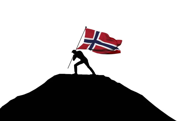 Norway flag being pushed into mountain top by a male silhouette. — Stock Photo, Image