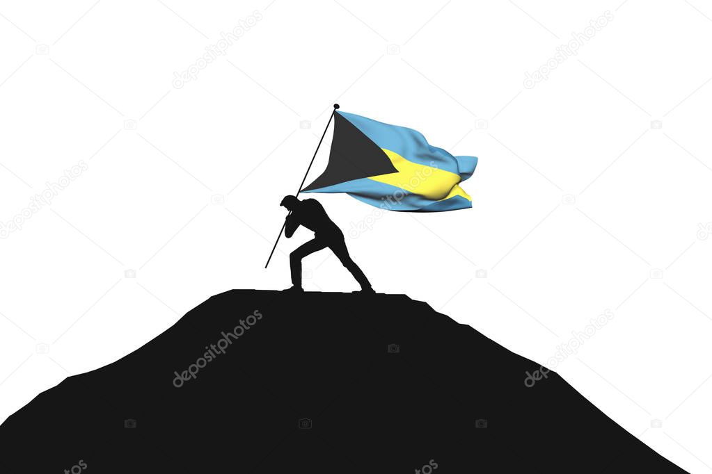Bahamas flag being pushed into mountain top by a male silhouette