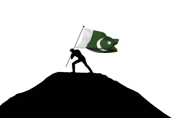 Флаг Пакистана был поднят на вершину горы самцом силуэта — стоковое фото