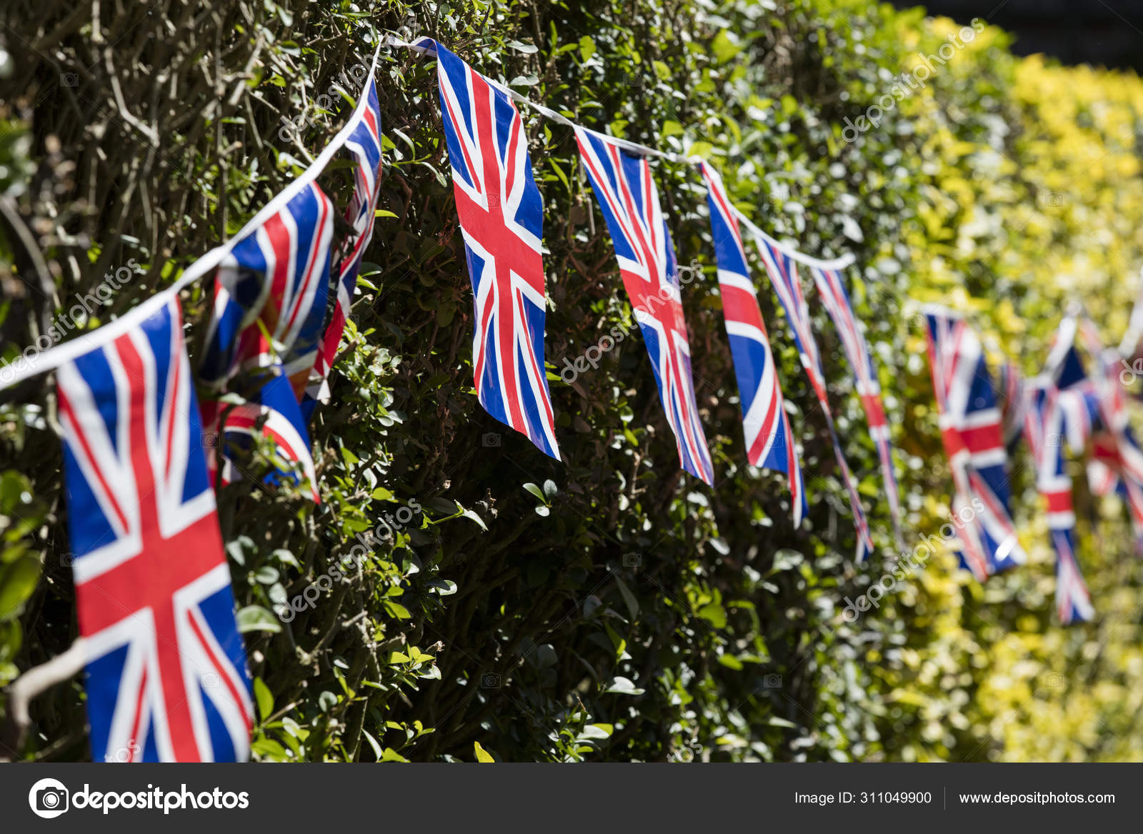 Union Jack flags hang in Windsor in preperation for the royal we