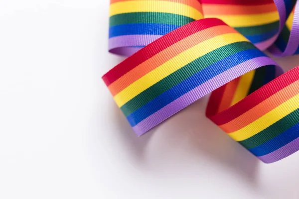 Gay pride LGBT rainbow ribbon on white background