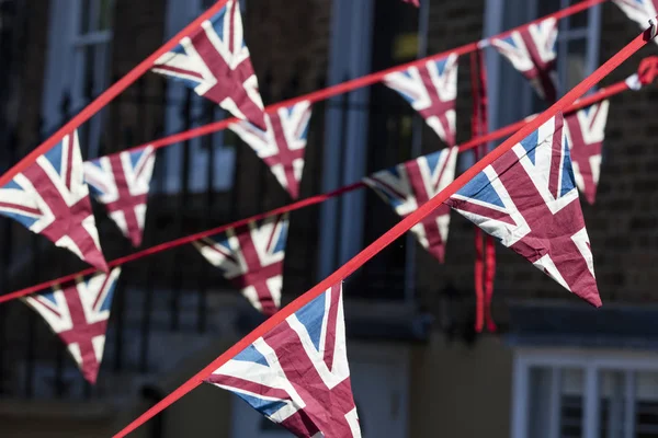 Union Jack flags hang in Windsor in preperation for the royal we — Stockfoto