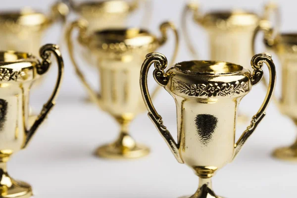 Gouden winnaars prestatie trofee achtergrond — Stockfoto