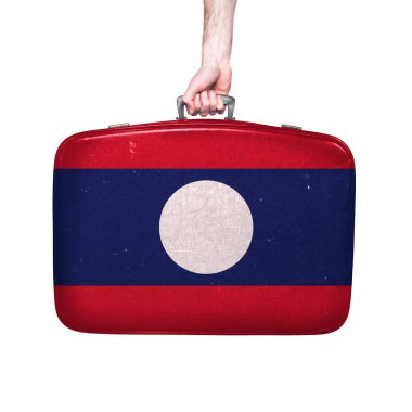 Eski bir deri bavul üzerinde Laos bayrağı.